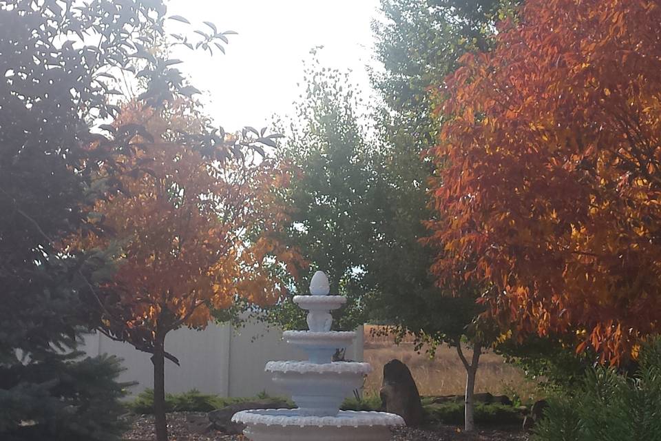 Tiered fountain by the autumn leaves