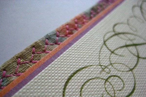 Textured paper with stitchwork layer