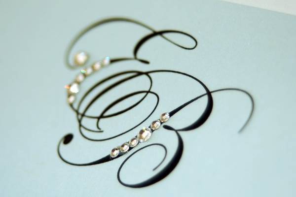 Monogram invitation adorned with Swarovski crystals.