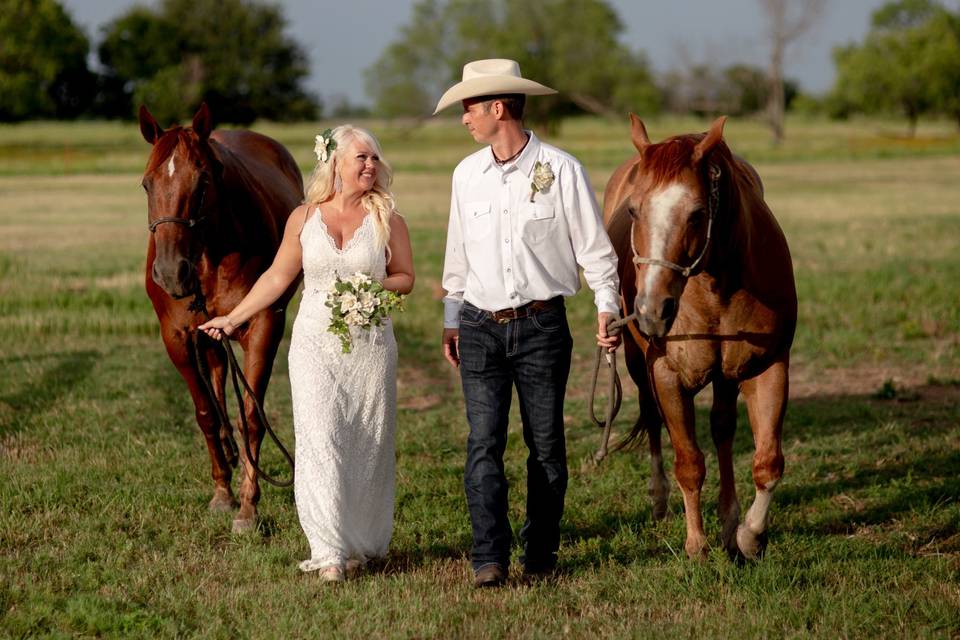 The happy couple and horses
