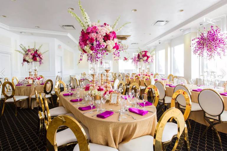 Oval tables with gold chairs