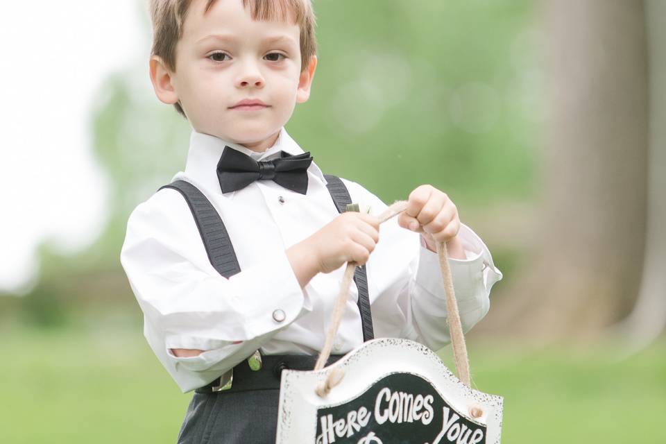 Little boy with the wedding sign