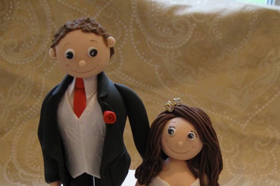 Super fun hand made bride and groom topper. this one was for a Christmas time wedding.