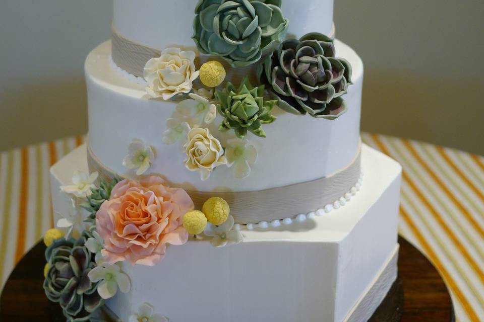 Sugar succulents and flowers add drama to this sweet buttercream cake