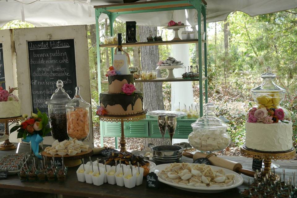 Dessert bar extroidinaire! Cakes, mousse cups, banana pudding, rice treats, eclairs, macarons, and more-oh my!!