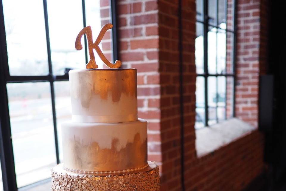 Gorgeous white and gold New Year's Eve wedding cake