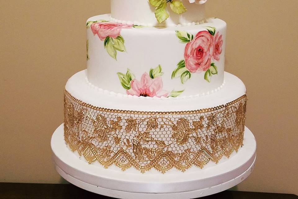 Hand painted roses, gold lace wedding cake