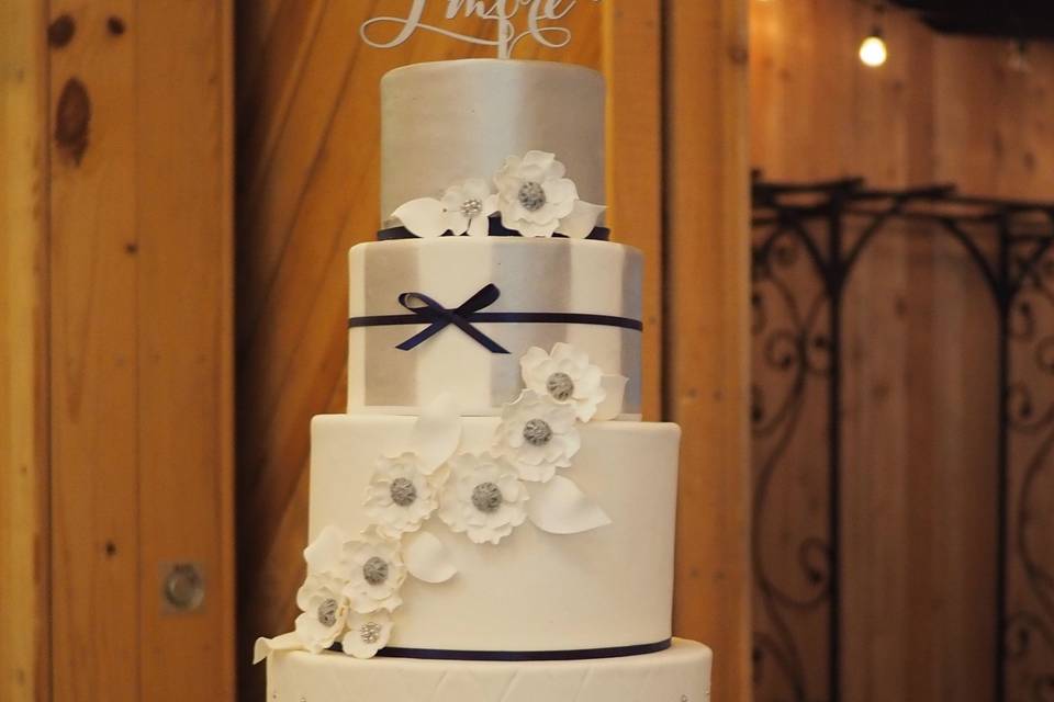 White and silver beauty accented with navy ribbons