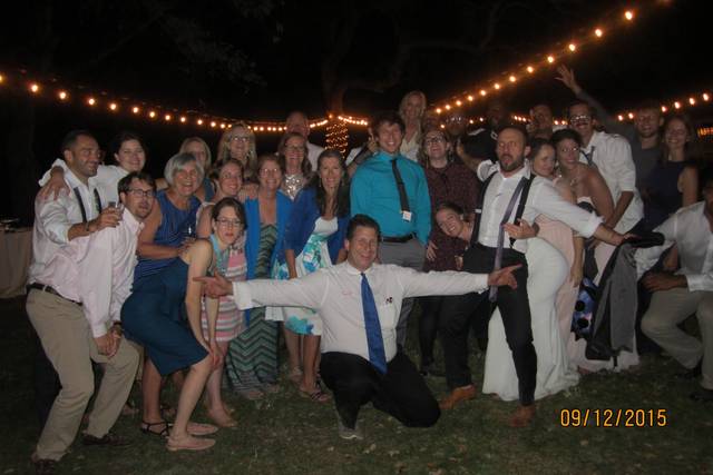 Couple with the DJ and guests