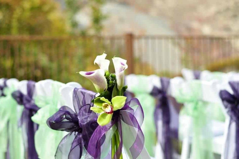 Isle char arrangement made of Green cymbidium Orchid  ans Picasso Lilly