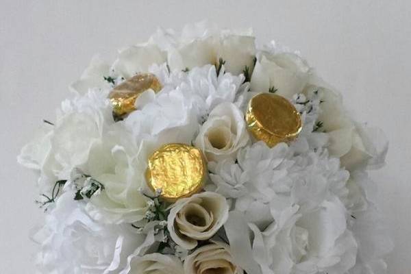 Edible Centerpiece.  Elegant floral arrangement with edible wedding favors attached (Chocolate Covered Oreo (available in gourmet flavors & crunches)).