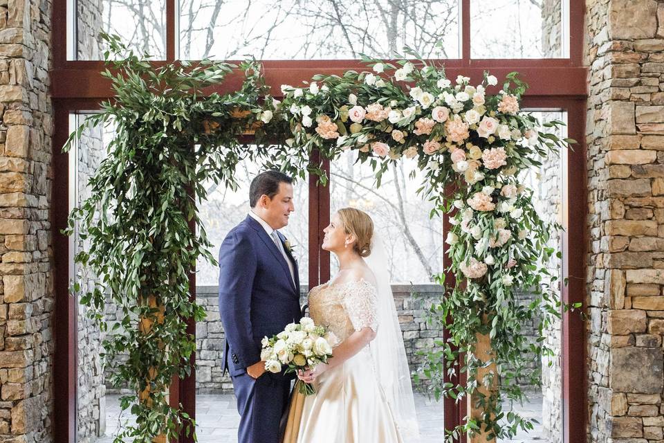 Wedding ceremony floral arbor