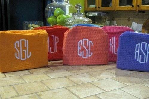 A great gift for graduation, bridesmaids or the traveller. This cosmetic bag is available in 12 colors:, lt pink, hot pink, lavender, chocolate, white, red, coral, aqua and purple. It is lined in a wipeable vinyl for easy clean up. The dimensions are 9