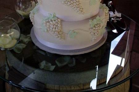 Three tier wedding cake with red roses