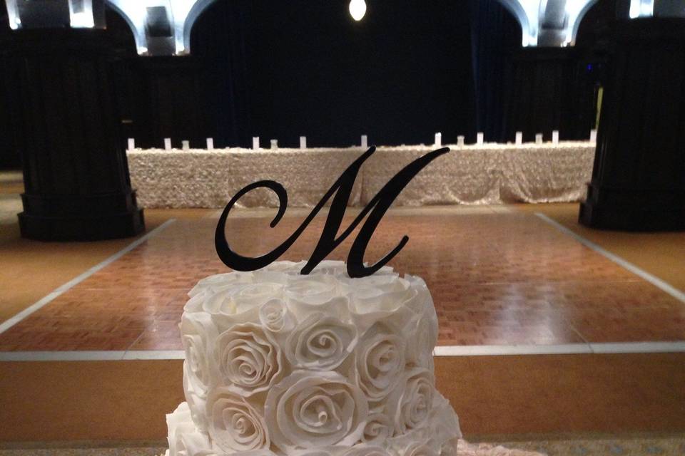 Four tier white and red wedding cake