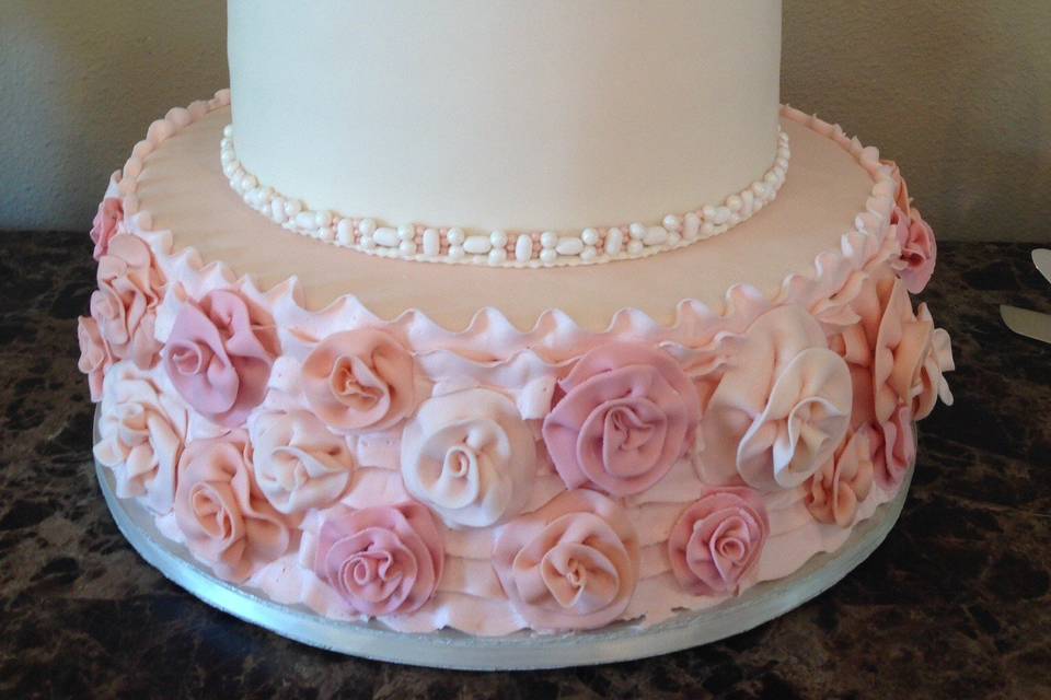 Four tier pink and white cake