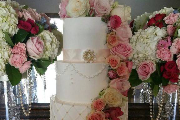 Five tier wedding cake with ascending flowers