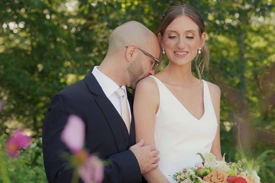 A tender kiss from the Groom.