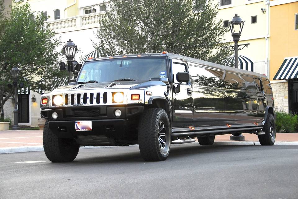 **Black H2 Super Stretch Hummer Limousines**SHARK LIMOUSINES The Black H2 Super Stretch Hummer Limousines lets you attack the night with up to twenty other man eaters! These shimmering super stars come equipped with multiple LCD TV’s, DVD player, front to back stainless steel mirrors, fiber optic lighting, premium sound system, and an incredible neon bar that is covered with coolers and champagne buckets. There is truly something for everyone in these vehicles, you can even swim to your very own VIP section in the back. Whether it is PROM TIME or PARTY TIME, SHARK LIMOUSINES H2 Hummer Limousines will let you attack the night in style!