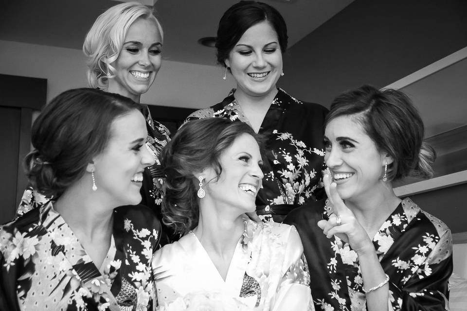 Lovely bride and her bridesmaids in their robes