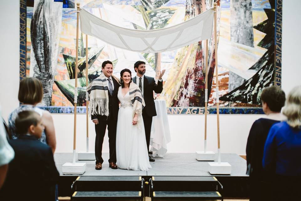 Chuppah in front of mural