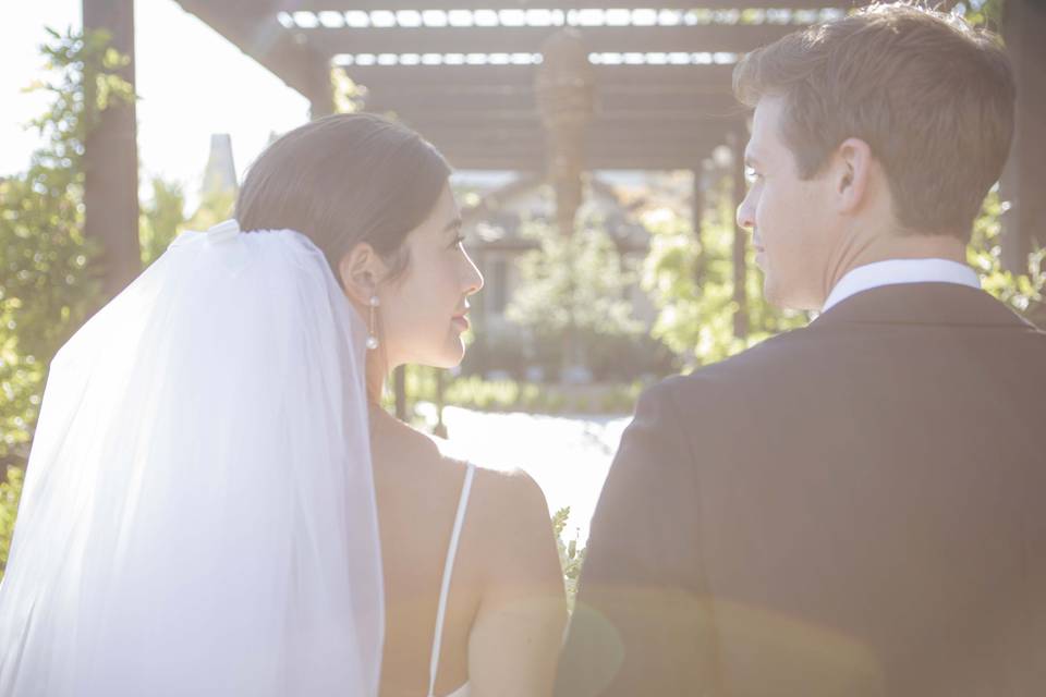 Bride and Groom under pergola