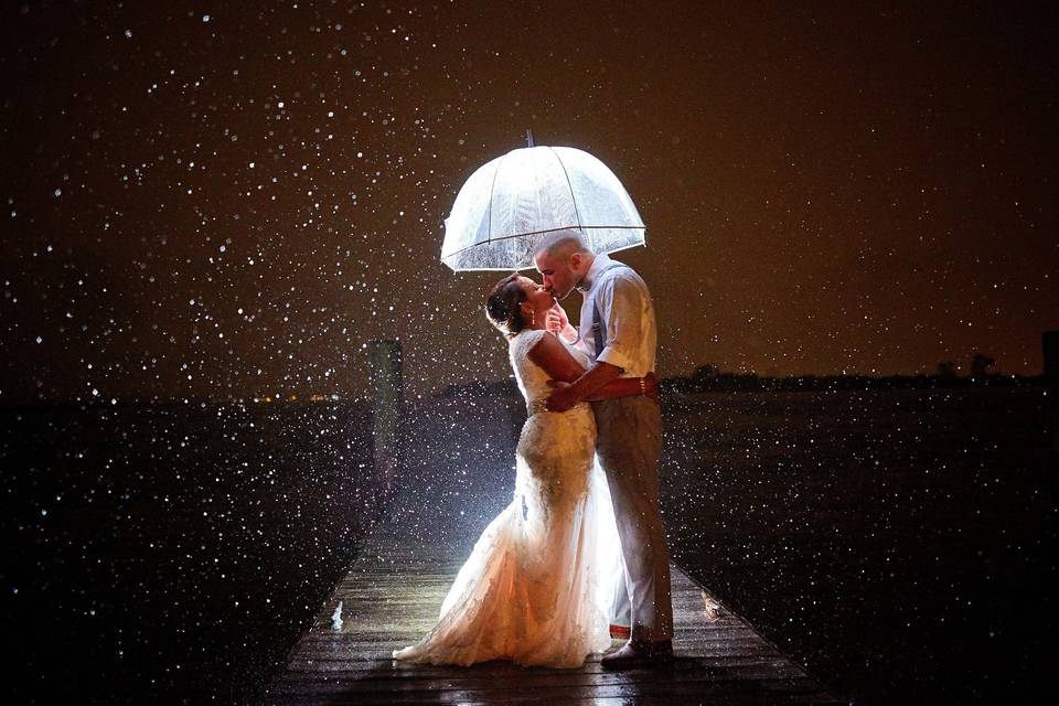 Night bride and groom in rain