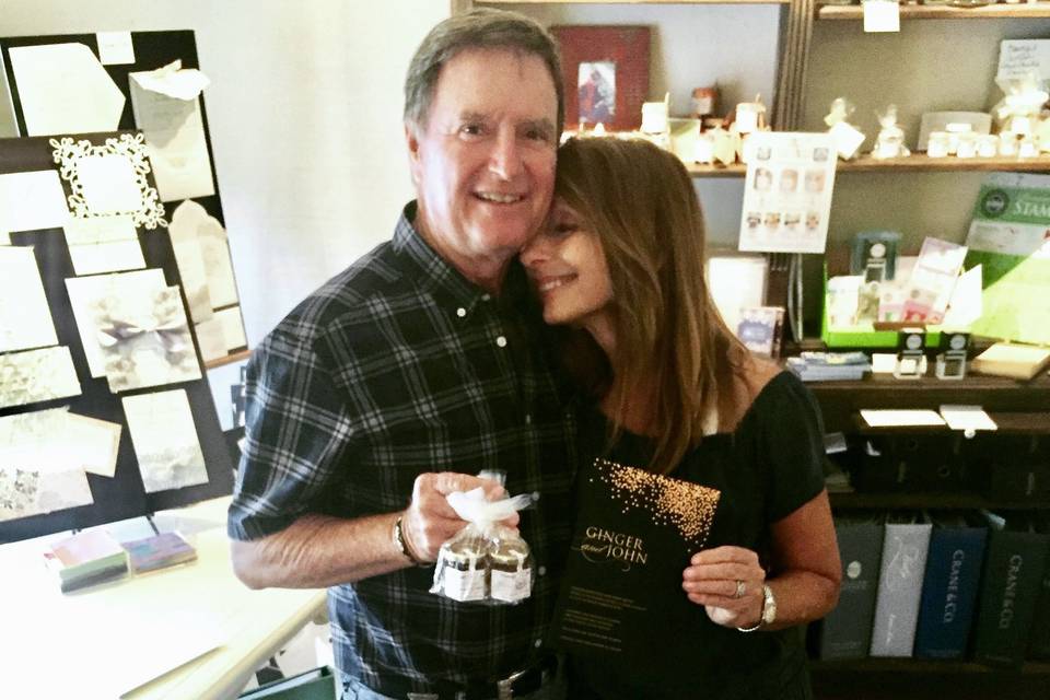 Bride and groom with their invites