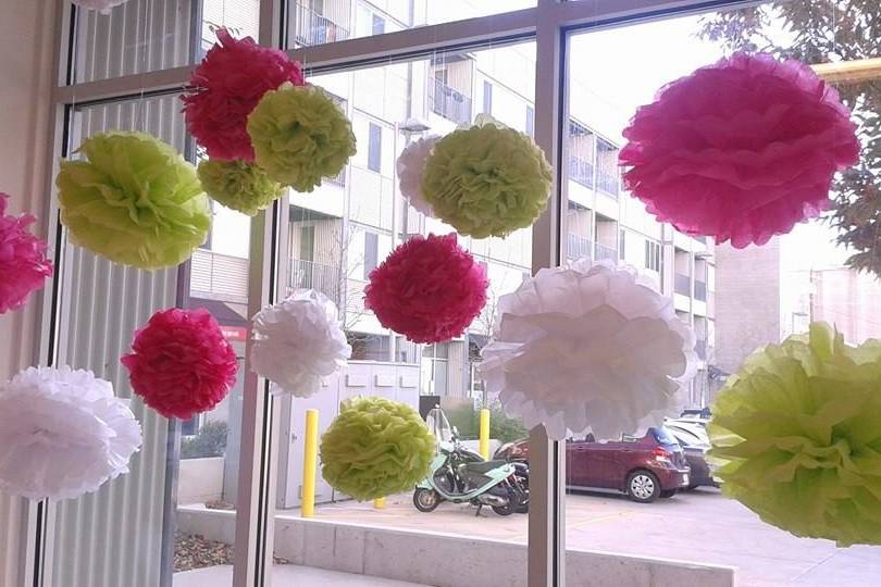 Handmade tissue pompoms at the bakery.