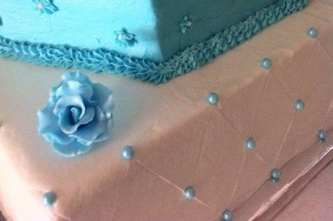 Three layered cake with blue flowers