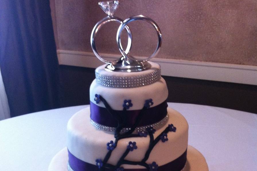 Wedding cake with rings on top