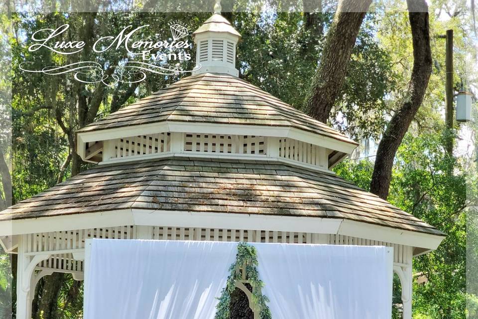 Wood Arch w/ garlands & drapes