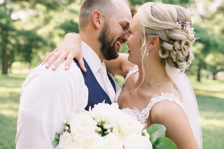 Couple smiling with bouquet