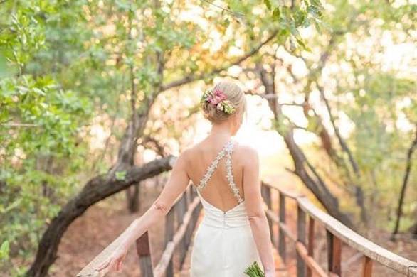 Walking along the shore in asymmetrical gown