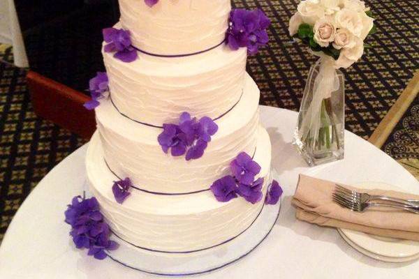 Classic layered wedding cake adorned with flowers