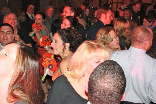 Most of our clients compliment us on playing music for guests of all ages. This picture shows a jam packed dance floor and many happy faces. - www.kennyq.com