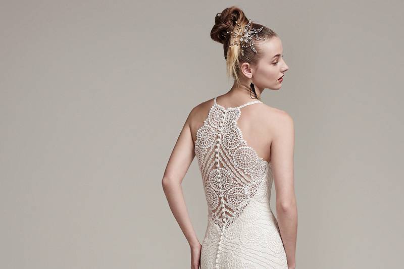 Bexley <br> Modern and romantic, this lace sheath wedding dress with spaghetti straps and V-neckline highlighted with opal beads is unforgettably feminine and chic. Finished with illusion lace halter back and covered buttons over zipper closure.