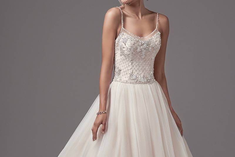 Jakayla	<br>	A bodice of Swarovski crystals and crosshatch embroidery accented in pearls adds luster and opulence to this tulle ballgown, featuring embellished spaghetti straps and illusion trim along the scoop neck and open back. Finished with covered buttons over zipper closure.