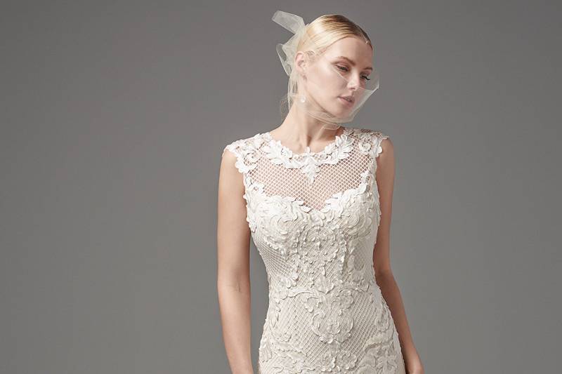 Suzanne Rose	<br>	This unique and glamorous fit-and-flare features laser-cut lace over textured netting and Viva jersey lining with a jewel neckline and modest cap-sleeves trimmed with lace appliqués. Finished with zipper closure.