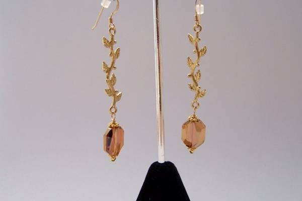 Versailles Earrings (color can be changed)
Ornate and elegant, when only an earring is needed for an elaborate gown. The Swarovski crystal at bottom can be changed to any color or shape upon request. 24kt covered brass leaves, 14kt gold-filled ear wires.