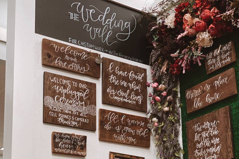 A wall of wedding signage