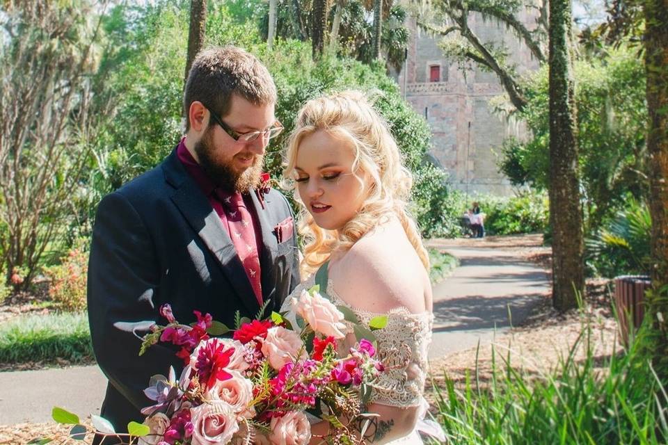 Couple standing with large bouquet