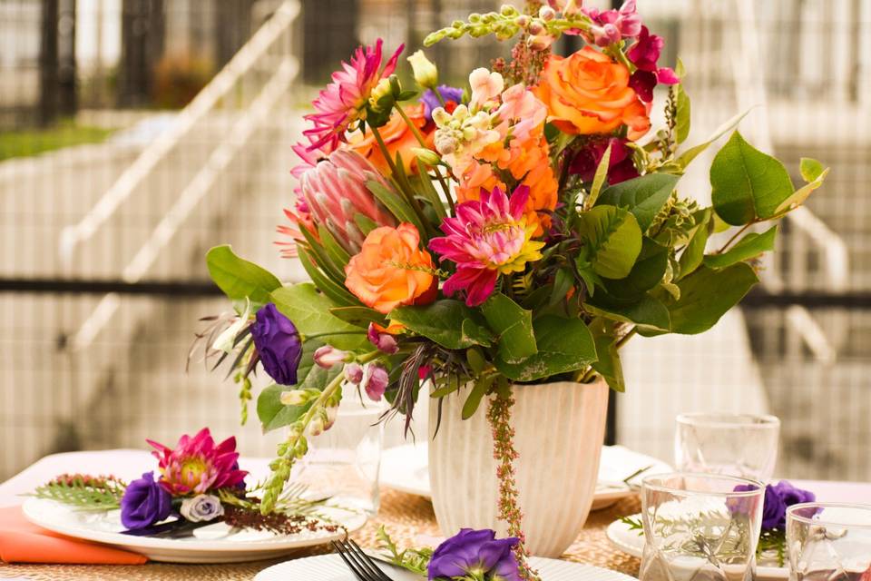 Table setting with orange and pink