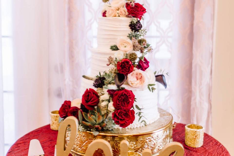 Wedding cake with red flowers