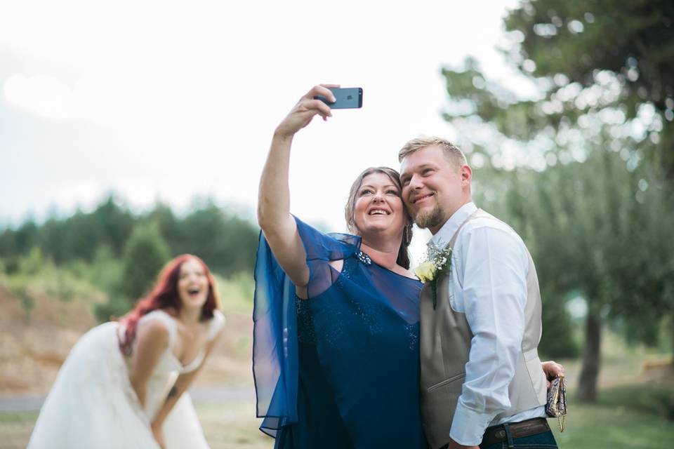 Mother of the Groom grabbing a selfie of her son and her!  Bride photobombs their attempt!  Great shot by our 2nd photographer Shellie Marie !!