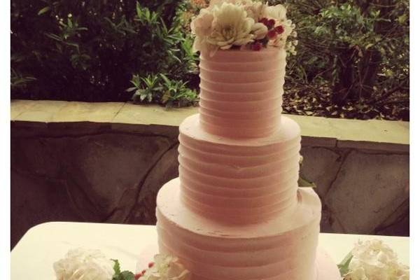 Four tier peach wedding cake