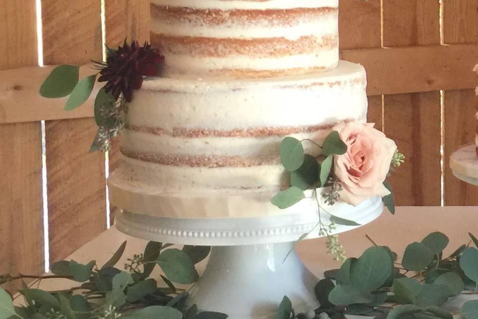 Three tier wedding cake with rose