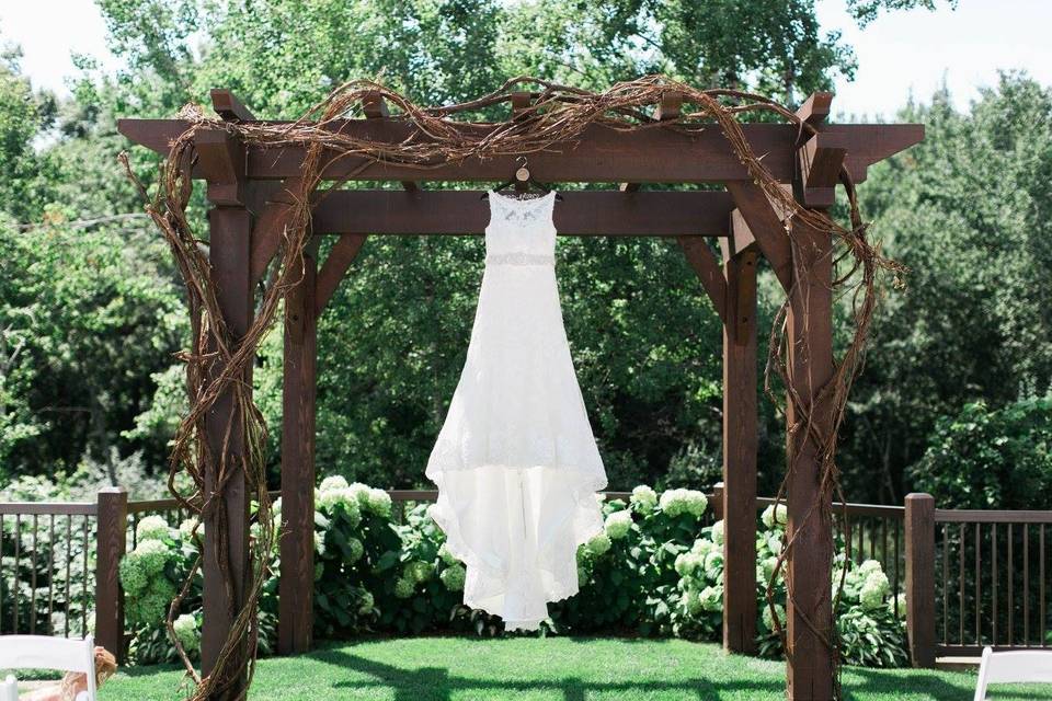 Wedding dress on arbor