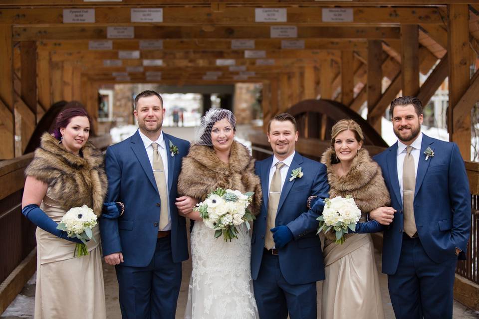 The couple with the bridesmaids and groomsmen