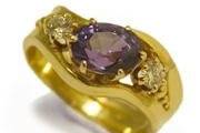 Engagement Ring
18k yellow gold with a purple sapphire and diamonds.